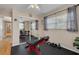 Workout room featuring mirrored closet doors, rubber flooring, and windows for natural light at 6114 7Th S Ave, Gulfport, FL 33707