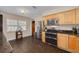 Kitchen with stainless steel appliances, wood cabinets, and tiled floor at 6114 7Th S Ave, Gulfport, FL 33707