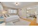 Light bedroom features a mirrored closet, stylish decor and hardwood floors at 6114 7Th S Ave, Gulfport, FL 33707