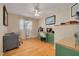 Bright office with hardwood floors, built-in desk, and a large window that provides natural light at 6114 7Th S Ave, Gulfport, FL 33707
