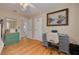 Bright office with hardwood floors, built-in desk, and a large window that provides natural light at 6114 7Th S Ave, Gulfport, FL 33707