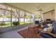 Relaxing screened patio featuring comfortable furniture, room for outdoor dining, and a view of the backyard at 6114 7Th S Ave, Gulfport, FL 33707
