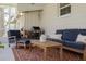 Relaxing screened patio featuring comfortable furniture, room for outdoor dining, and a view of the backyard at 6114 7Th S Ave, Gulfport, FL 33707