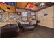 Unique recreation room with wood ceilings, stone walls, seating area and pinball machines at 6114 7Th S Ave, Gulfport, FL 33707