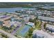 Beautiful aerial view of waterfront community with tennis court and pool at 616 Garland Cir, Indian Rocks Beach, FL 33785