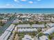 Stunning aerial view of the coastal community, showcasing proximity to the water and lush surroundings at 616 Garland Cir, Indian Rocks Beach, FL 33785