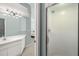 Bright bathroom features a vanity with a shower stall at 616 Garland Cir, Indian Rocks Beach, FL 33785