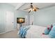 Bright bedroom with ceiling fan, comfortable bed, and modern TV for a relaxing space at 616 Garland Cir, Indian Rocks Beach, FL 33785