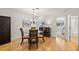 Bright dining room with table and chairs next to an open entryway at 616 Garland Cir, Indian Rocks Beach, FL 33785