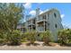 Multi-story condo building featuring balconies and well maintained landscaping at 616 Garland Cir, Indian Rocks Beach, FL 33785