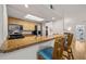 Inviting kitchen with a breakfast bar, stainless steel appliances, and stylish seating at 616 Garland Cir, Indian Rocks Beach, FL 33785