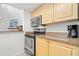 Modern kitchen featuring stainless steel appliances and ample counter space for cooking and entertaining at 616 Garland Cir, Indian Rocks Beach, FL 33785