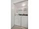 Efficient laundry room features a side-by-side washer and dryer at 616 Garland Cir, Indian Rocks Beach, FL 33785