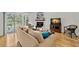 Inviting living room boasts a fireplace and a sliding door to a patio at 616 Garland Cir, Indian Rocks Beach, FL 33785