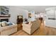 Spacious living room with hardwood floors, fireplace, and comfortable furnishings at 616 Garland Cir, Indian Rocks Beach, FL 33785