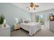 Comfortable main bedroom boasts a queen bed, dresser, and sliding glass doors to a balcony at 616 Garland Cir, Indian Rocks Beach, FL 33785