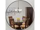 Reflection of a dining area in a circular mirror, showcasing modern features at 616 Garland Cir, Indian Rocks Beach, FL 33785