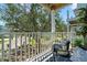 Cozy balcony seating area with stylish decor and a peaceful outdoor view at 616 Garland Cir, Indian Rocks Beach, FL 33785