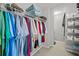 Well-organized walk-in closet features hanging clothes, shelves, and organizers at 616 Garland Cir, Indian Rocks Beach, FL 33785