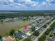 Beautiful lakefront home with pool, lush yard, and waterfront views, offering a serene and private retreat at 6425 Clair Shore Dr, Apollo Beach, FL 33572