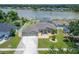 Aerial view of the home's well-maintained lawn, fenced-in backyard and landscaping at 6425 Clair Shore Dr, Apollo Beach, FL 33572