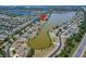 Aerial view of the property with beautiful landscaping and lakefront with neighborhood at 6425 Clair Shore Dr, Apollo Beach, FL 33572