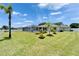 Large backyard with a screened pool area, landscaped lawn, and garage offers ample space at 6425 Clair Shore Dr, Apollo Beach, FL 33572