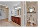 Dual vanity sink, a separate toilet room, and walk-in closet make this bathroom luxurious and functional at 6425 Clair Shore Dr, Apollo Beach, FL 33572