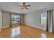 Bright and airy bedroom with beautiful wood floors, neutral paint, and plenty of natural light at 6425 Clair Shore Dr, Apollo Beach, FL 33572