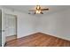 Bedroom with wood-look floors, closet, and ceiling fan at 6425 Clair Shore Dr, Apollo Beach, FL 33572