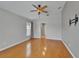 This spacious bedroom features hardwood floors, light gray walls, and neutral window coverings at 6425 Clair Shore Dr, Apollo Beach, FL 33572