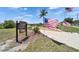 Close up of waterfront neighborhood gathering space with American flags at 6425 Clair Shore Dr, Apollo Beach, FL 33572