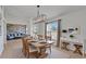 Bright dining room with wood table, decorative lighting, and a view to the living room at 6425 Clair Shore Dr, Apollo Beach, FL 33572
