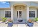 Close up of home's front entrance with double door and overhead lighting at 6425 Clair Shore Dr, Apollo Beach, FL 33572