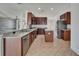 Well-equipped kitchen featuring stainless steel appliances, granite countertops, and a breakfast bar at 6425 Clair Shore Dr, Apollo Beach, FL 33572