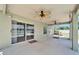 Spacious outdoor lanai with ceiling fans overlooks the sparkling pool and lush backyard at 6425 Clair Shore Dr, Apollo Beach, FL 33572