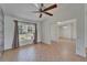 Living room with tile flooring, ceiling fan, and natural light at 6425 Clair Shore Dr, Apollo Beach, FL 33572