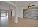 Spacious living room with tile floors, ceiling fans, and sliding glass doors to the pool area at 6425 Clair Shore Dr, Apollo Beach, FL 33572