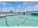Gorgeous pool in a screened enclosure with spa, all set for relaxation and entertainment at 6425 Clair Shore Dr, Apollo Beach, FL 33572