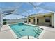 Screened pool with spa, spillover, and covered lanai, perfect for outdoor entertaining at 6425 Clair Shore Dr, Apollo Beach, FL 33572