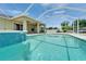 A beautiful pool with a screened enclosure and open lanai, ideal for relaxation and enjoyment at 6425 Clair Shore Dr, Apollo Beach, FL 33572