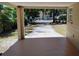 Covered back porch offering an outdoor space for relaxation at 6434 Old Main St, New Port Richey, FL 34653