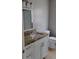 Updated bathroom vanity with granite countertop, modern fixtures, and tile flooring at 6434 Old Main St, New Port Richey, FL 34653