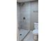 Bathroom featuring a shower with tile surround and tile flooring at 6434 Old Main St, New Port Richey, FL 34653