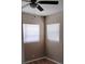Charming bedroom with wood-look flooring and a ceiling fan and lots of natural light at 6434 Old Main St, New Port Richey, FL 34653