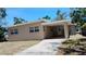 A view of the exterior featuring a covered patio at 6434 Old Main St, New Port Richey, FL 34653