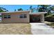 A view of the exterior featuring a covered patio at 6434 Old Main St, New Port Richey, FL 34653