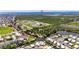 Aerial view of a neighborhood situated along canals and with access to the open bay at 6522 Simone Shores Cir, Apollo Beach, FL 33572