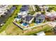 Aerial view features house and canal, highlighting its prime location in a coastal community at 6522 Simone Shores Cir, Apollo Beach, FL 33572