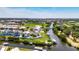 Aerial view of home nestled in a waterfront community, offering stunning canal access at 6522 Simone Shores Cir, Apollo Beach, FL 33572